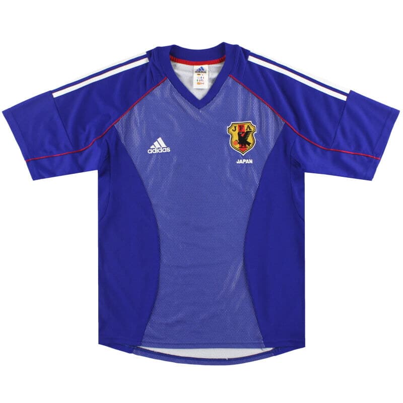 Japan 2002 home shirt, front: royal blue with tonal mesh side panels, white adidas shoulder stripes, red trim, a V-neck and the JFA crest.