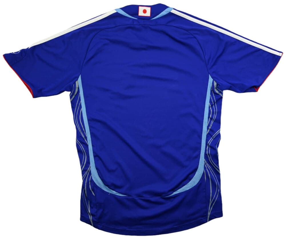 Japan 2006 home shirt, back: blue with the light-blue wave graphics sweeping up the sides and red collar trim.