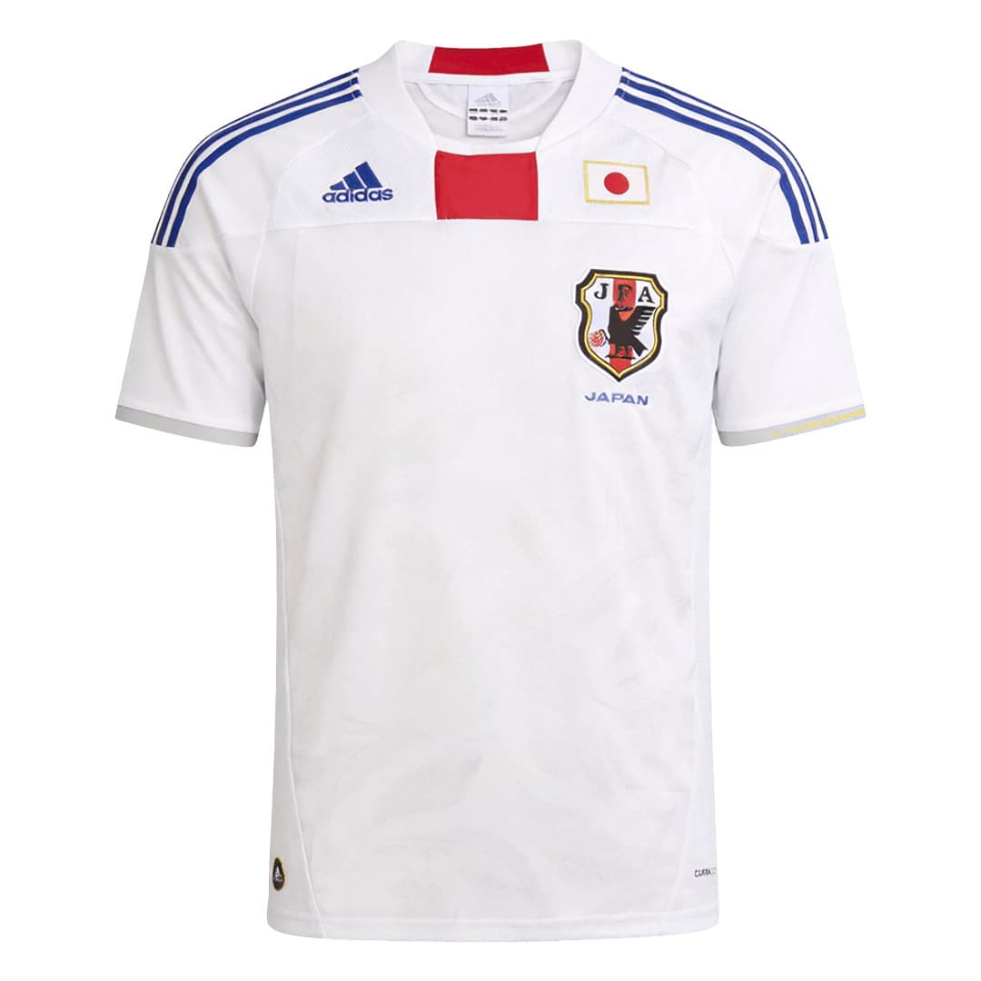 Japan 2010 away shirt, front: white with a tonal feather pattern, blue adidas stripes, a red block beneath the collar, the JFA crest and the Japan flag.