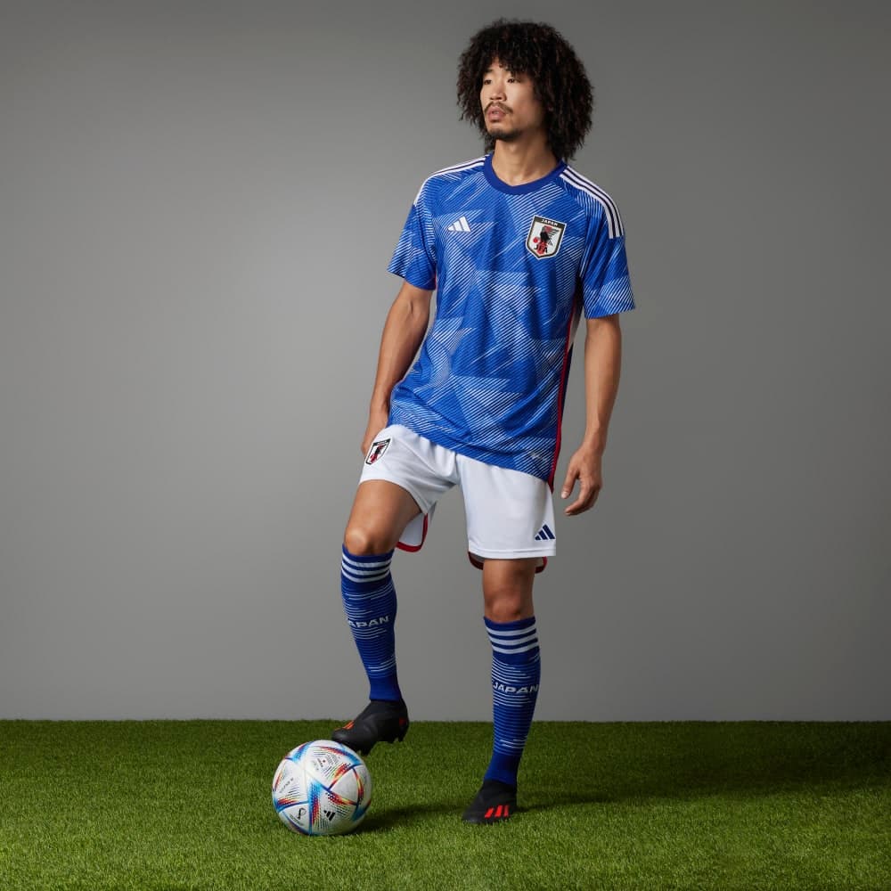 The Japan 2022 home kit worn on-body with the Qatar 2022 match ball.