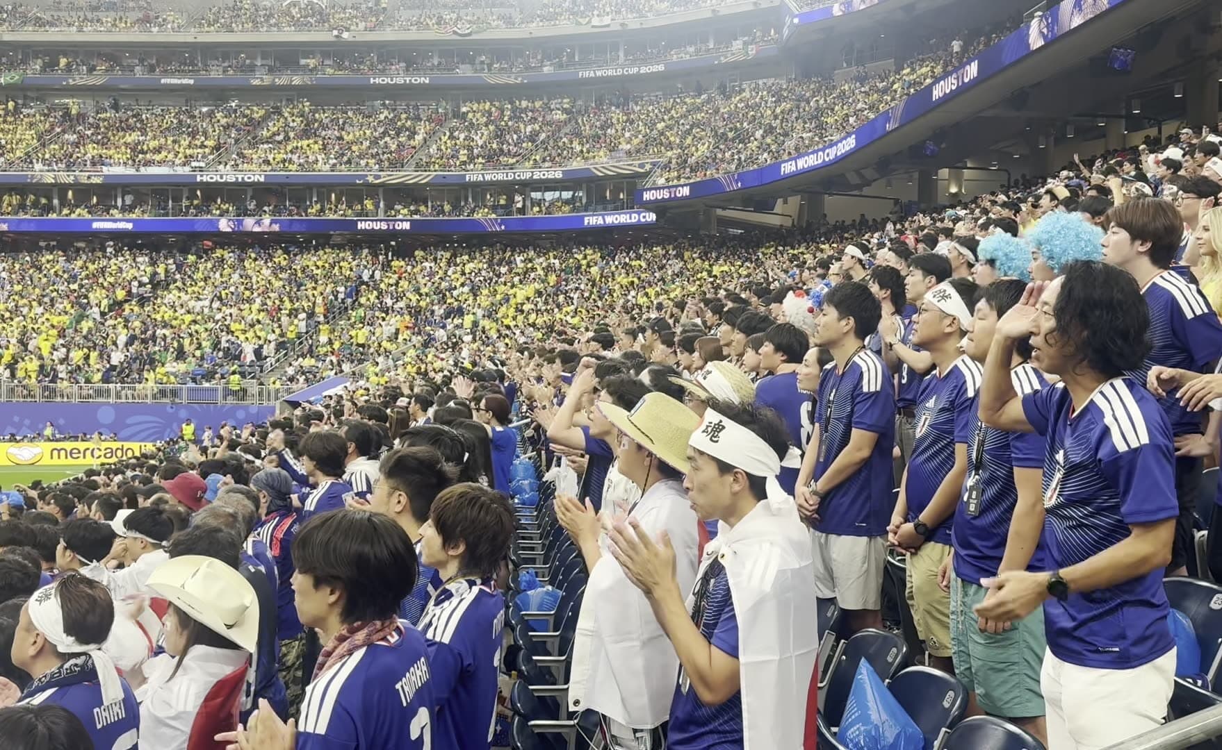 Japan's away end at the 2026 World Cup in Houston: thousands of supporters in blue against Brazil's yellow